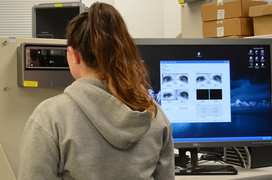 A student using an iris scan for multimodal data collection.